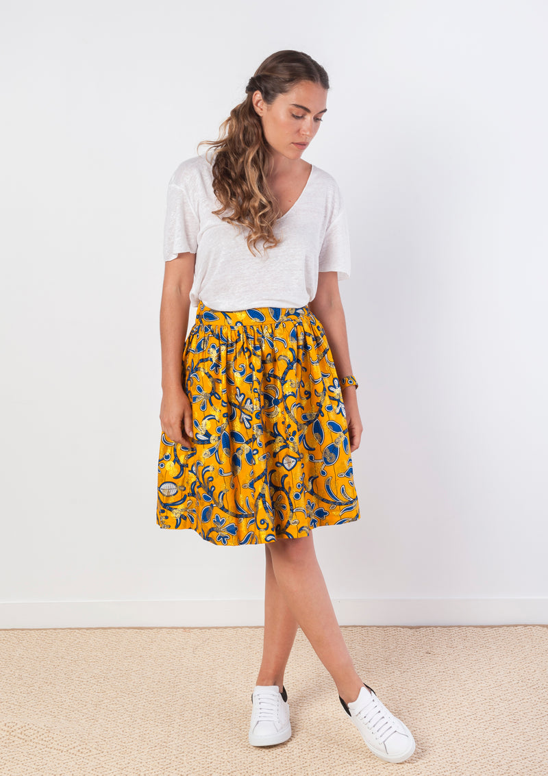 Cora & Lea-woman-Bowie évasé skirt and long midi. African Wax-Print, yellow, blue and gold stamping. 